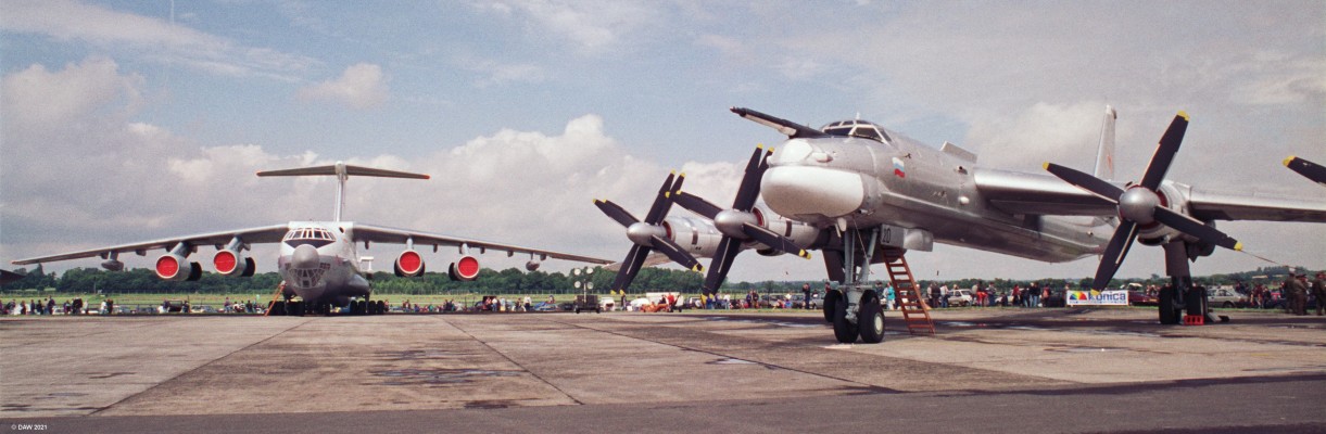 Russian IL-76 transport and TU-95 bomber, Fairford, 1993
The Ilushin II-76 first entered service in 1974 with the Soviet Union as a strategic transport aircraft capable of lifting up to 40 tons.  It has the capability of using unpaved runways so has seen use widely in disaster recovery around the world.  New varients remain in production today with over 900 having been produced.  It is also used commercialy for oversided loads.
