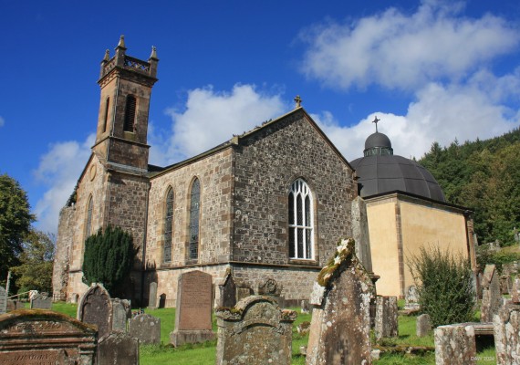 Kilmun Parish Church
Built on the site of a celtic monstery, the present church dates from 1841.  The building at the rear is a Mausoleum for the Dukes of Argyll.
