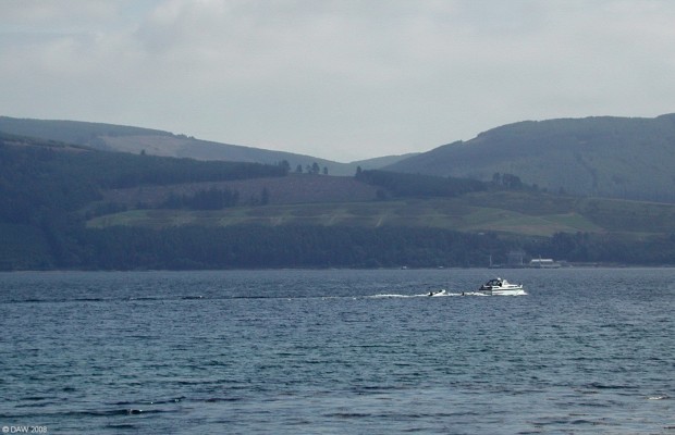 Loch Striven NATO Fuel Depot
The jetty is just above the passing boat but if you look on the hill side you can see the buried fuel tanks covering a large area.  This view is from the Bute side of Loch Striven.  [url=http://www.streetmap.co.uk/streetmap.dll?G2M?X=206400&Y=670040&A=Y&Z=5/] Map location. [/url]
