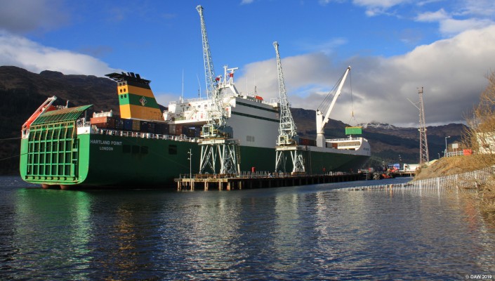 MV Hartland Point, Glenmallen munitions jetty
One of the 6 "Point Class" Sea Lift ships built under a private finance initiative for the UK MoD.  She was built by Harland & Wolf in Belfast and commissioned in 2002.  Displacing some 23,000 tons she is designed as a RoRo ship via the stern door or as is the case here for transporting containers on the top deck.  There are 2650 linear metres of space for vehicles.  This photo was taken early in 2016. [url=http://streetmap.co.uk/map.srf?X=224915&Y=696431&A=Y&Z=120/] Map location. [/url]

