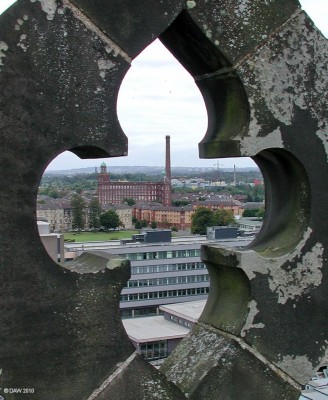 Mile End Mill, Paisley
A view of the Mile End Mill through stone work at the top of Paisley Abbey tower.
