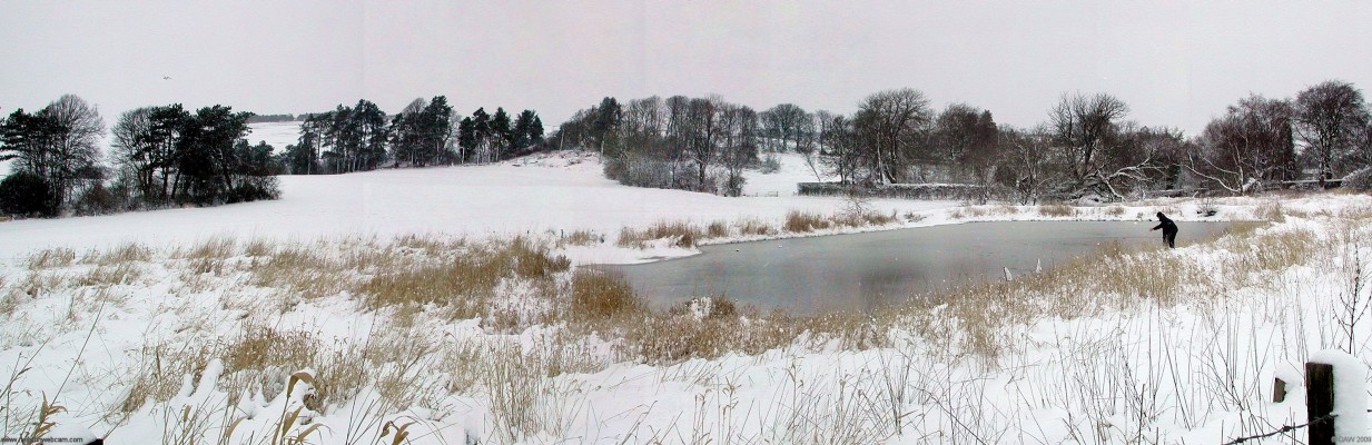 The old Mill pond in winter
Lintmill Bleaching and Finishing Company had a factory associated with this pond until early in the 20th century,  some bits of the building are still standing.   The field in the background is currently where the annual Neilston Show takes place.  [url=http://www.streetmap.co.uk/map.srf?X=248325&Y=657434&A=Y&Z=120/] Map location. [/url]
