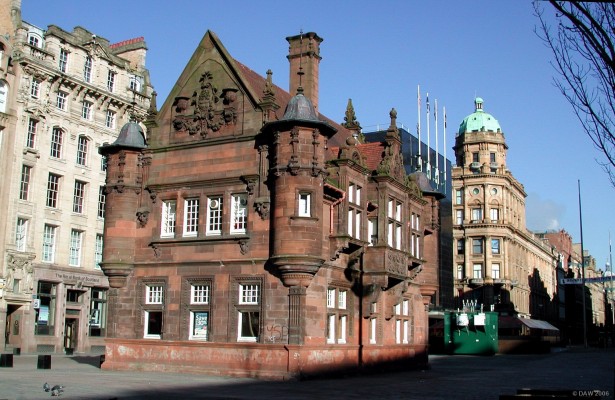 St Enoch Square, Glasgow
St Enoch square was originally created in 1783 for grazing sheep.  In 1876 St Enoch Railway station was built but was demolished and replaced by the St Enoch Centre shopping centre in the mid 1980's   The building pictured here was the St Enoch subway station, built in 1896.  The most remarkable thing about this building is that it was saved at great expense whilst the Subway station below was reconstructed in the late 1970's.  The entrance to the modern station is now behind the green box.
