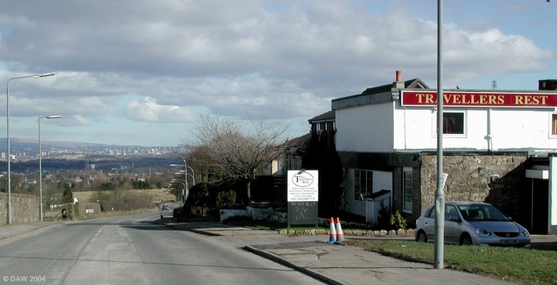 Down the hill to Barrhead
Everywhere else is downhill from Neilston.   Barrhead is the first place you meet, Glasgow can be seen in the distance.  The Travellers Rest is on the right hand side.   http://www.travellersrest-scotland.co.uk
