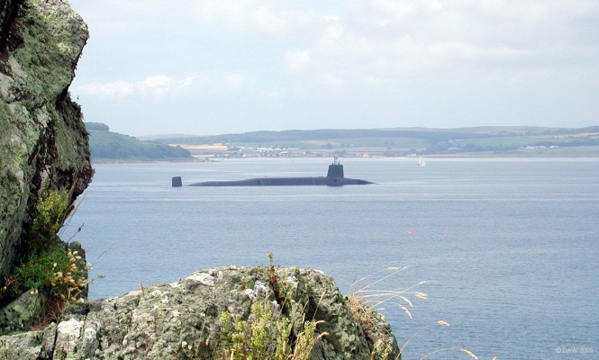 Royal Navy, Vanguard Class Ballistic Missile Submarine, Firth of Clyde
One of the Royal Navy's 4 Vanguard Class Submarines slips between the Wee Cumbrae and Bute on its way home to Faslane.  These are the largest submarines ever built in the UK, displacing some 16,000 tons and with a submerged speed of 25kt+.  They can carry up to 48 warheads each with a yield of around 100kt, 5 times that of Hiroshima.
