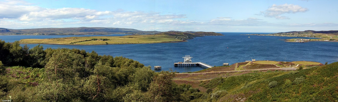 NATO fuel depot, Aultbea
Over looking Loch Ewe from above the NATO Petroleum, Oil and Lubricants (POL) depot at Aultbea.  The jetty is also designated as a 'Z Berth' which means it can be used by any NATO Nuclear Submarine requiring maintenance.  The isle of Ewe can be seen in the middle of the loch. [url=http://www.streetmap.co.uk/map.srf?X=186298&Y=889582&A=Y&Z=115&ax=187688&ay=887340/] Map location. [/url]

